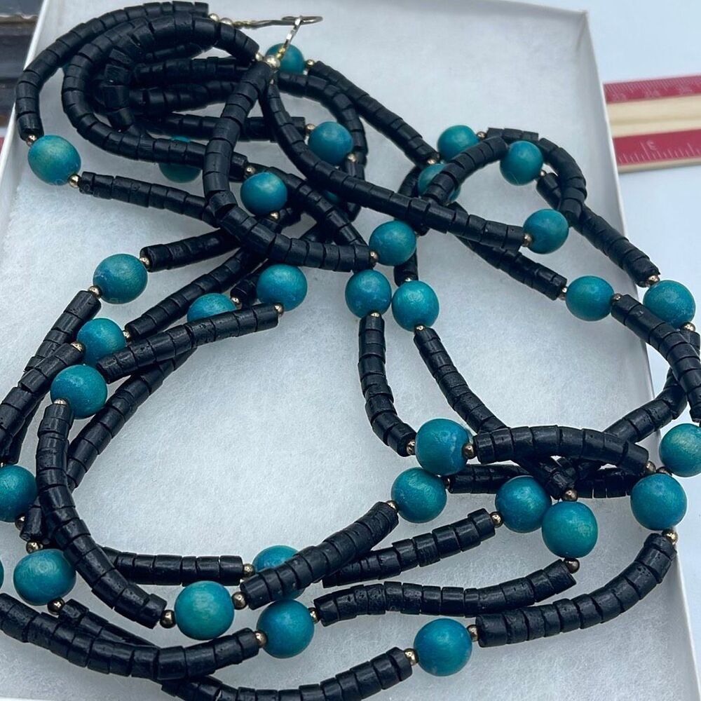 Vintage 4 strand wooden beaded boho festival necklace.